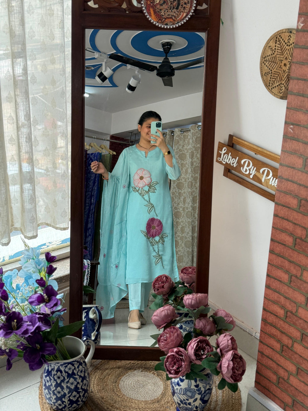 Woman wearing sky blue 3D embroidered suit set with floral embroidery, matching pants and dupatta by Label by Pushp